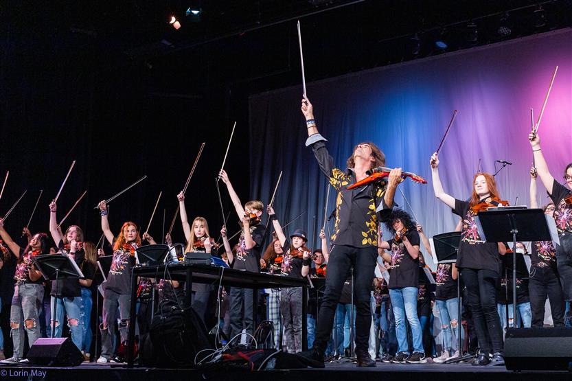 Orchestra students perform onstage